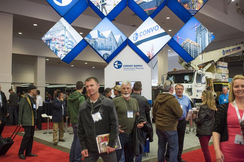 The Convoy supply trade show booth on a crowded trade show floor.