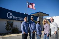 Convoy staff outside of our Maryland branch with the US flag flying.